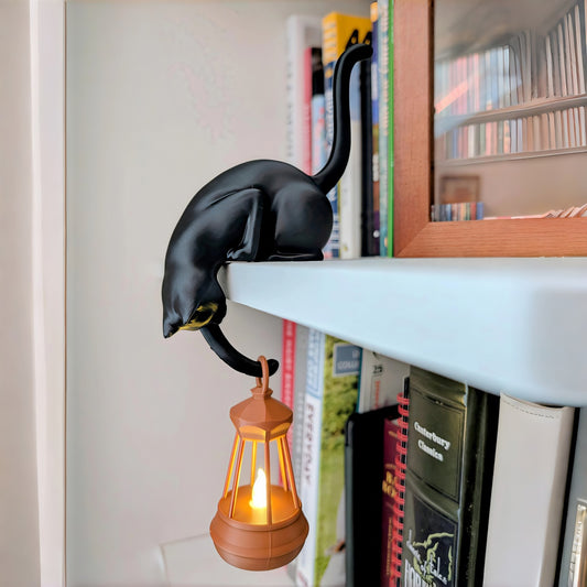 Black cat shelf ornament holding hanging flickering lantern For Cat Lovers & Bookworms