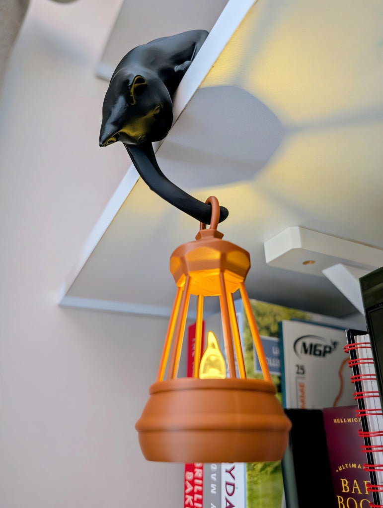 Black cat shelf ornament holding hanging flickering lantern For Cat Lovers & Bookworms